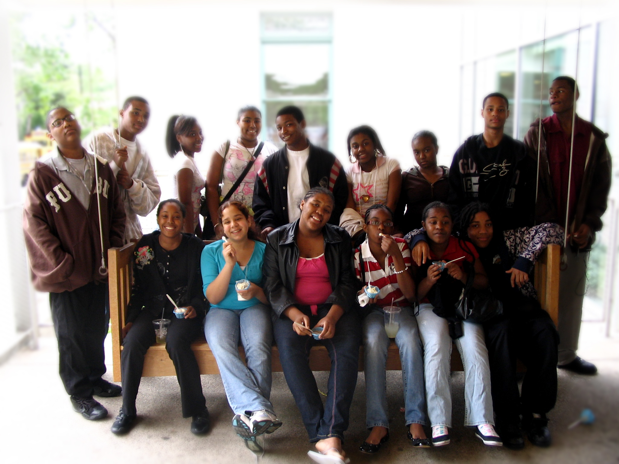 Fifteen teens smiling and posing in profile