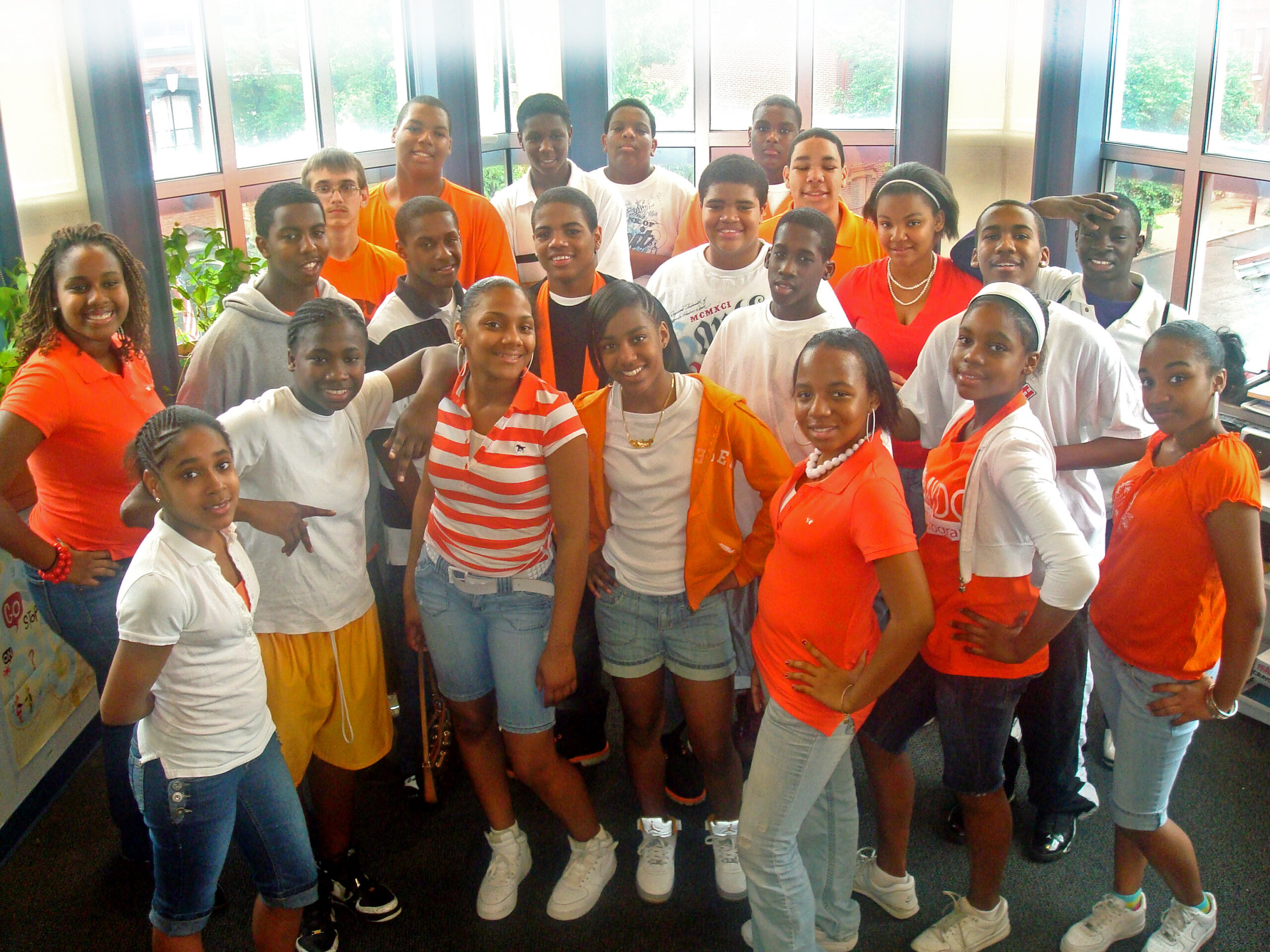 Twenty-two teens smiling and standing in profile