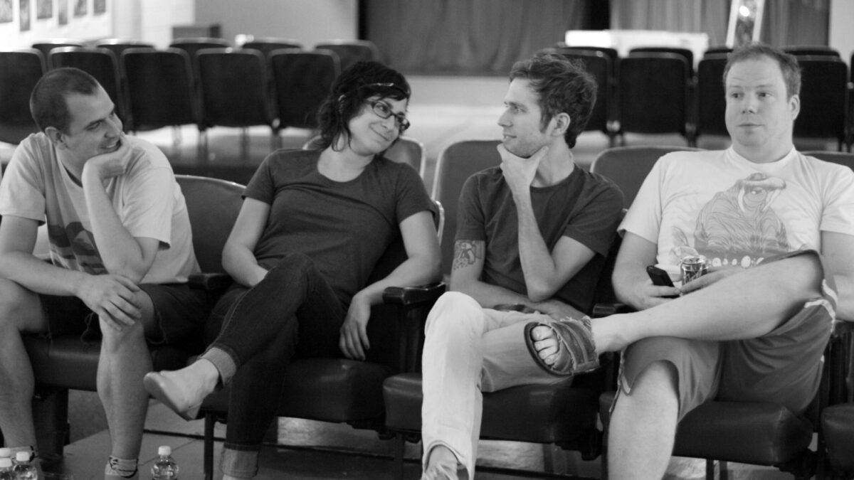 2010-07-17-Sat Show pics 003 A black and white image of four adults sitting on a couch