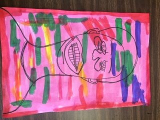A drawing of an outline of a human face with several multicolored thick lines made with markers covering the drawing, all on a pink background