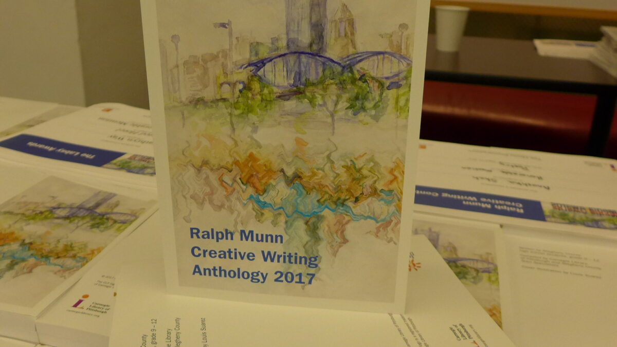An art piece of the Pittsburgh skyline with the text "Ralph Munn Creative Writing Anthology 2017" in blue in the bottom left corner
