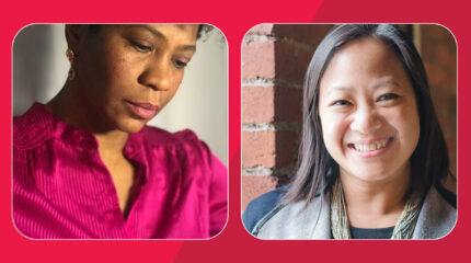 Adult wearing earrings and a pink shirt looking down in profile, and an adult with long dark brown hair and a gray sweater smiling in profile