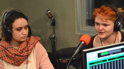 two teens speaking in a radio studio