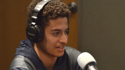a teen speaking in a radio studio