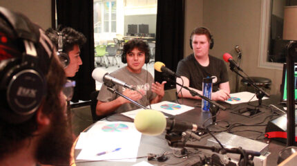 four teens speaking in a radio studio