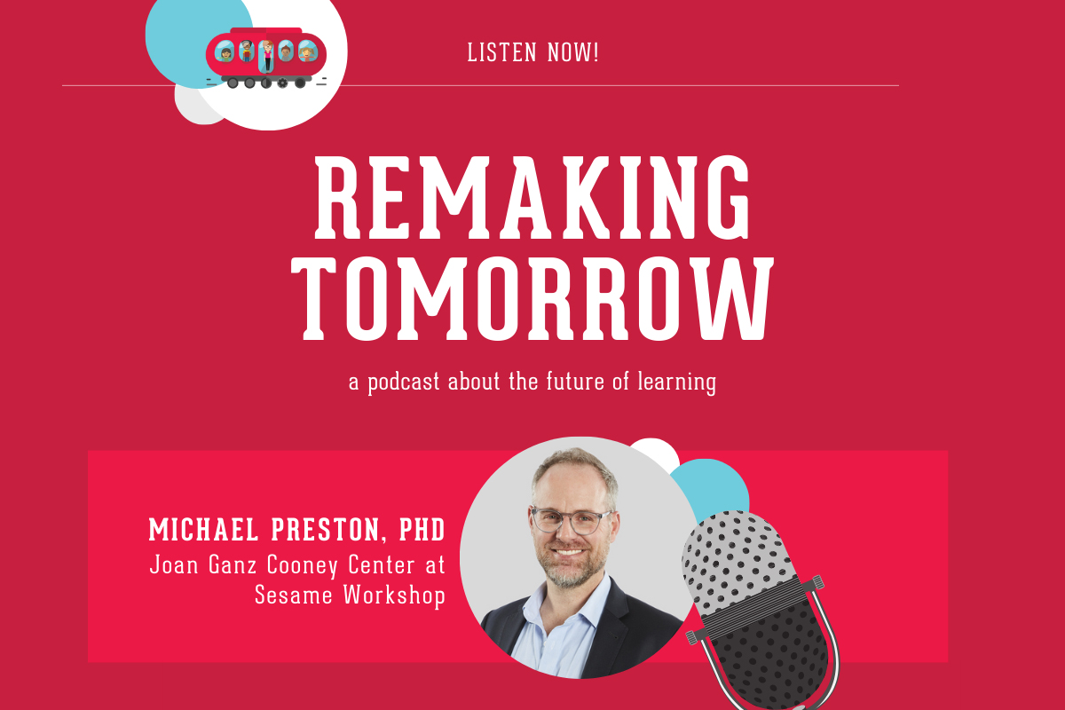 adult in business attire and glasses profiled on light background