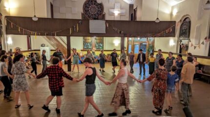 A group of adults walking in a circle in a church