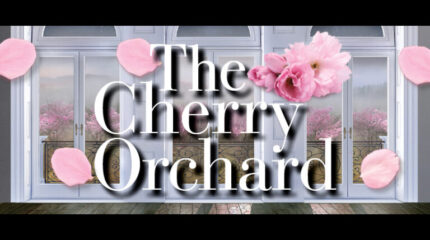 An image of windows overlooking an orchard of cherry blossom trees, with the text "The Cherry Orchard" surrounded by cherry blossoms