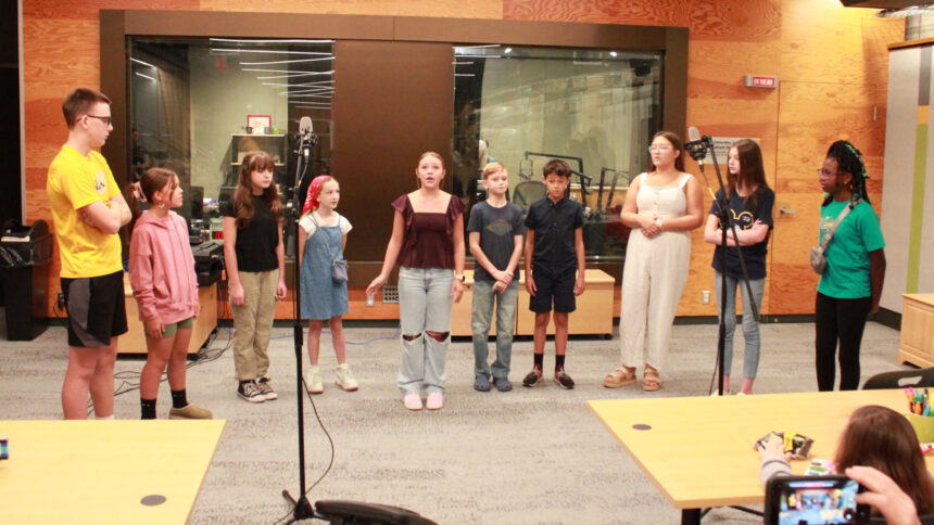 Ten youth singing in a choir