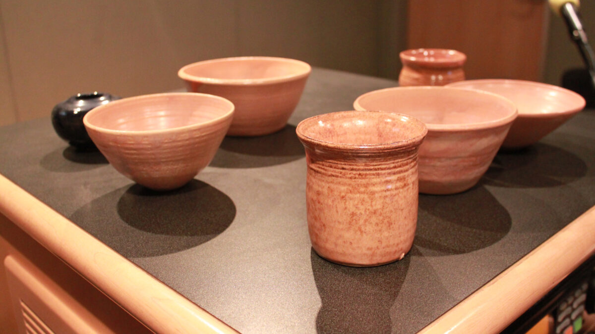 A collection of ceramic bowls and cups in a radio studio
