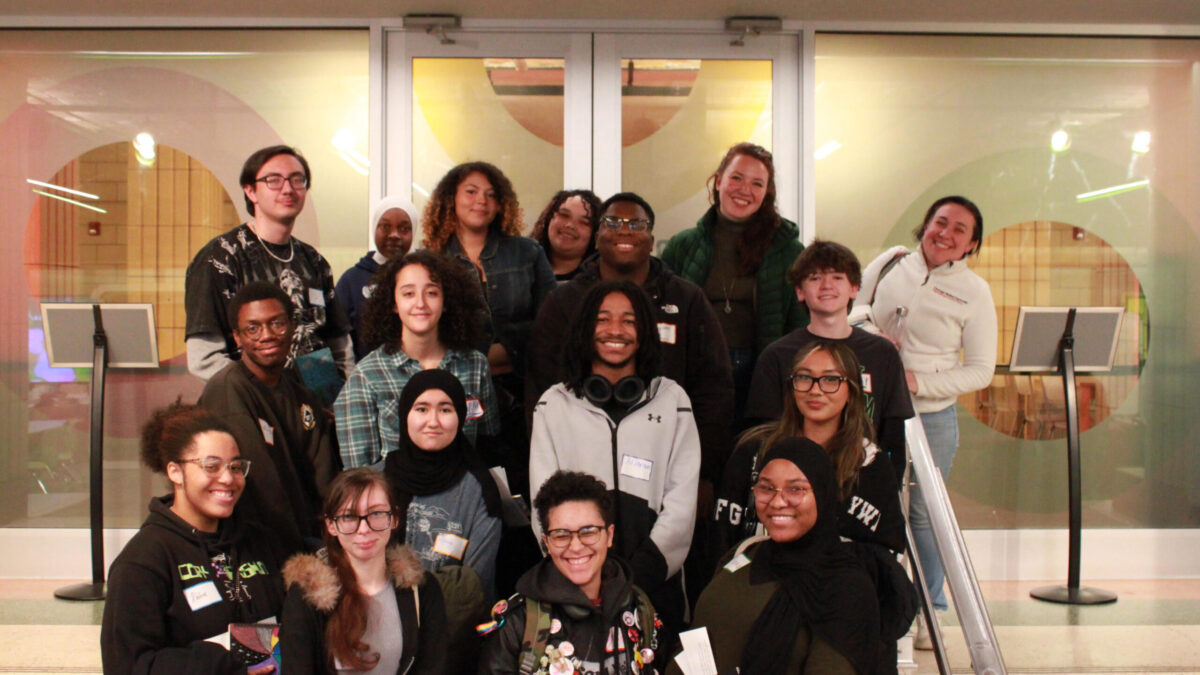 unnamed (3) Fourteen teens and two adults smiling while standing on a set of stairs