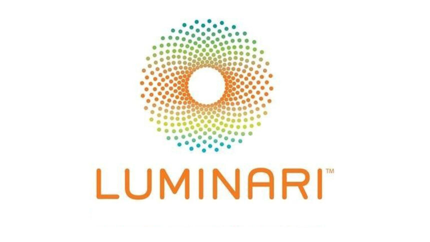A circular graphic of rainbow colored dots, with the text "Luminari" underneath in orange