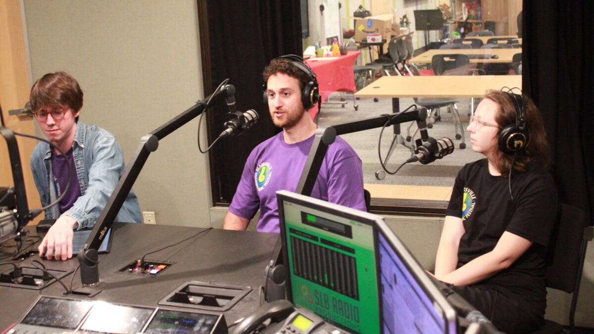 Blairsville-Chamber-Music-Society-Music-Festival-2 Three adults, two wearing headphones, speaking into microphones in a radio studio