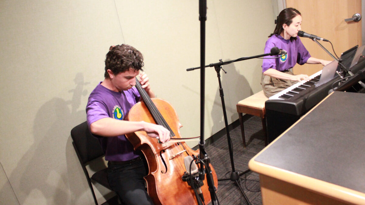 Blairsville-Chamber-Music-Society-Music-Festival-3 An adult playing cello and an adult playing a piano keyboard in a radio studio